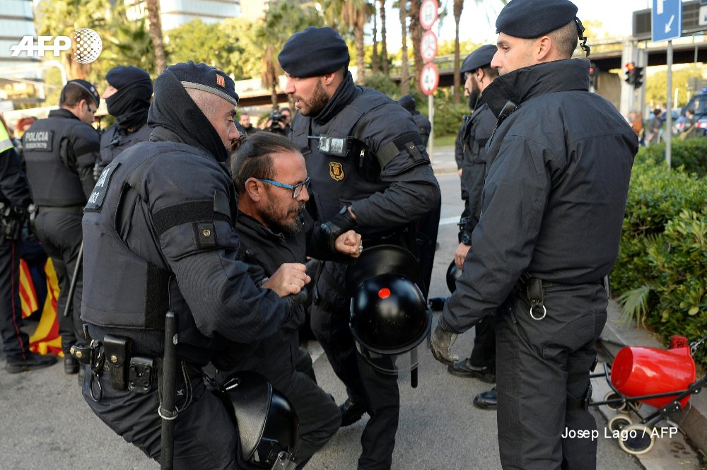 Protesters block roads and train tracks in Catalonia as part of a region-wide strike called by pro-independence union